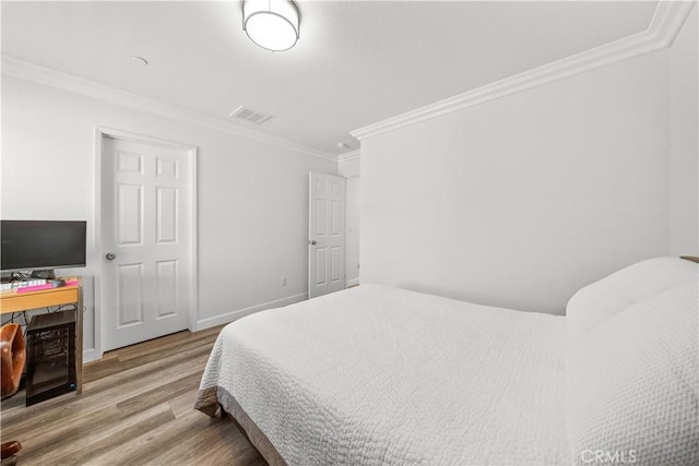 9804 Ardisia St, Riverside, CA 92503 - bedroom with wood finished floors and crown molding