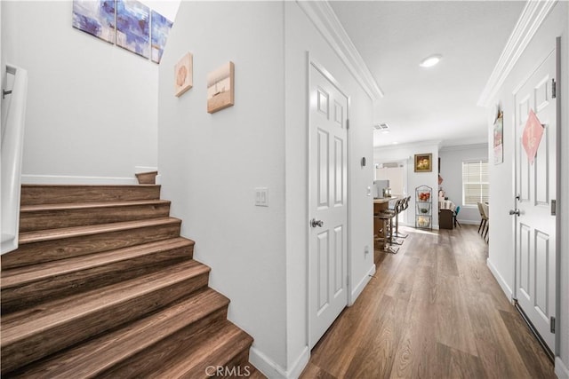 9804 Ardisia St, Riverside, CA 92503 - corridor with ornamental molding, wood finished floors, stairway, and recessed lighting