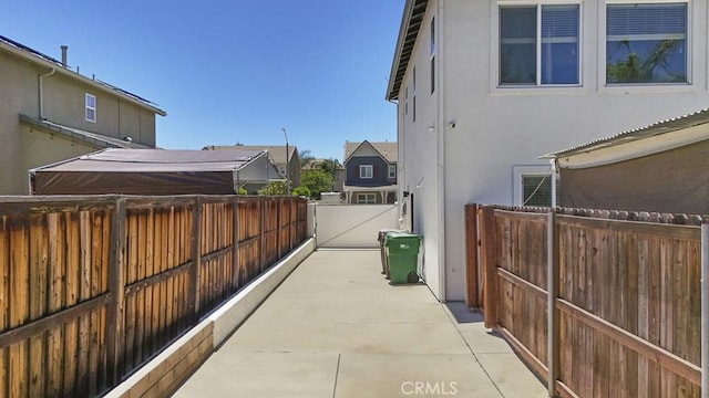 32420 Apricot Tree Rd, Winchester, CA 92596 - view of side of property with stucco siding, a patio, and a gate