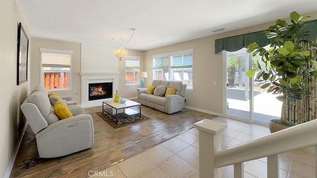 32420 Apricot Tree Rd, Winchester, CA 92596 - living area with a glass covered fireplace and wood finished floors
