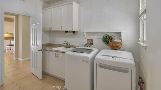 32420 Apricot Tree Rd, Winchester, CA 92596 - washroom with light tile patterned flooring, separate washer and dryer, and cabinet space