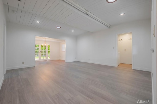 1725 Turnbull Canyon Rd, Hacienda Heights, CA 91745 - unfurnished room with light wood-style flooring, a chandelier, recessed lighting, and beamed ceiling