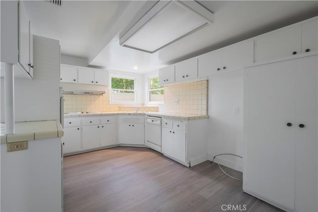 1725 Turnbull Canyon Rd, Hacienda Heights, CA 91745 - kitchen with dishwasher, backsplash, light wood-style floors, and white cabinets