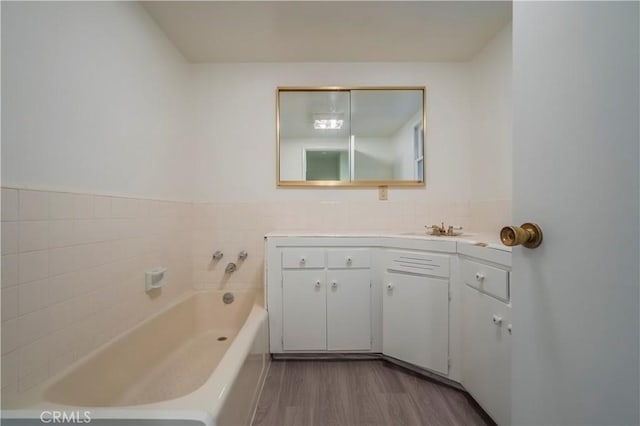 1725 Turnbull Canyon Rd, Hacienda Heights, CA 91745 - full bathroom featuring a bath, vanity, and wood finished floors