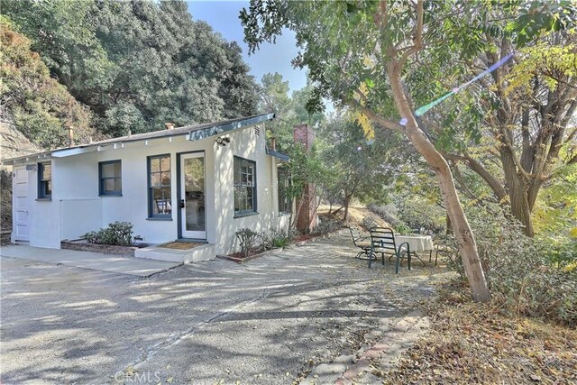 330 N Madison Ave, Monrovia, CA 91016 - view of front facade with stucco siding and a patio