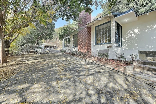 330 N Madison Ave, Monrovia, CA 91016 - view of property exterior featuring a chimney and stucco siding