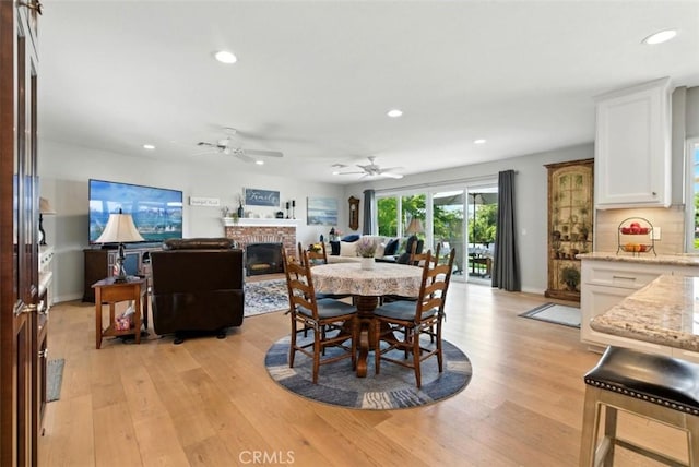 3526 Alder Pl, Chino Hills, CA 91709 - dining area featuring recessed lighting, a brick fireplace, light wood-style flooring, and ceiling fan