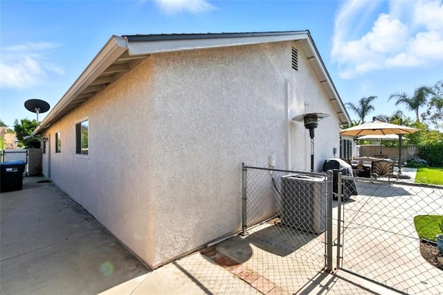3526 Alder Pl, Chino Hills, CA 91709 - view of side of property featuring a gate, stucco siding, and a patio area