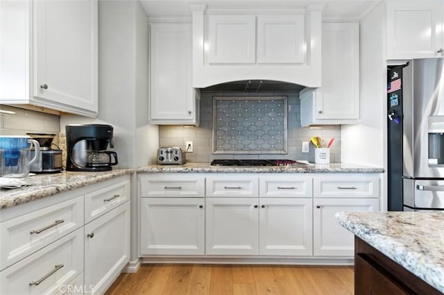 3526 Alder Pl, Chino Hills, CA 91709 - kitchen featuring stainless steel appliances, white cabinets, backsplash, and premium range hood