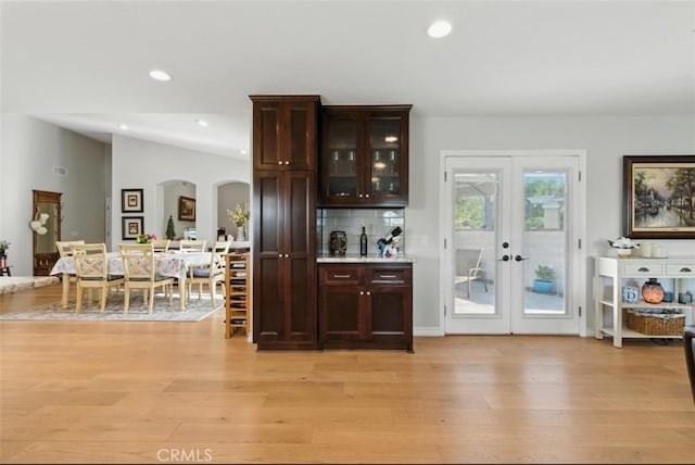 3526 Alder Pl, Chino Hills, CA 91709 - bar with light wood finished floors, french doors, arched walkways, recessed lighting, and tasteful backsplash