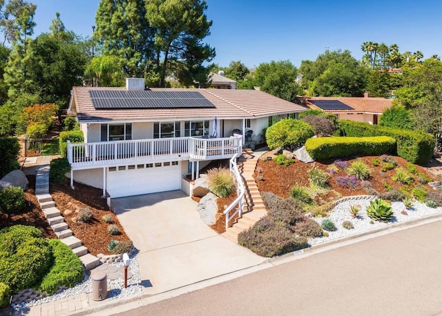 10518 Moon View Way, Escondido, CA 92026 - ranch-style home featuring stairway, a porch, solar panels, stucco siding, and an attached garage