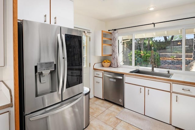 10518 Moon View Way, Escondido, CA 92026 - kitchen featuring stainless steel appliances, white cabinets, light tile patterned flooring, and light countertops