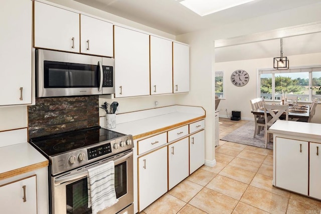 10518 Moon View Way, Escondido, CA 92026 - kitchen with appliances with stainless steel finishes, light countertops, light tile patterned flooring, backsplash, and pendant lighting