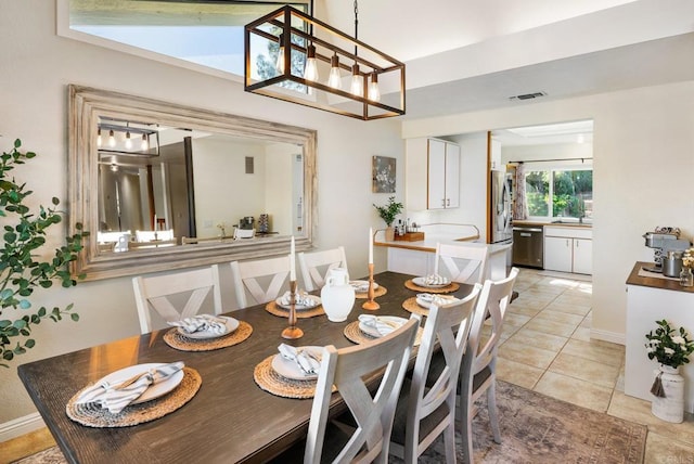 10518 Moon View Way, Escondido, CA 92026 - dining space with light tile patterned floors and a chandelier