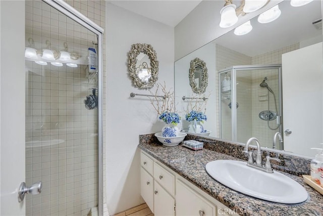 9909 Merced River Ave, Fountain Valley, CA 92708 - bathroom featuring a stall shower, vanity, and tile patterned flooring