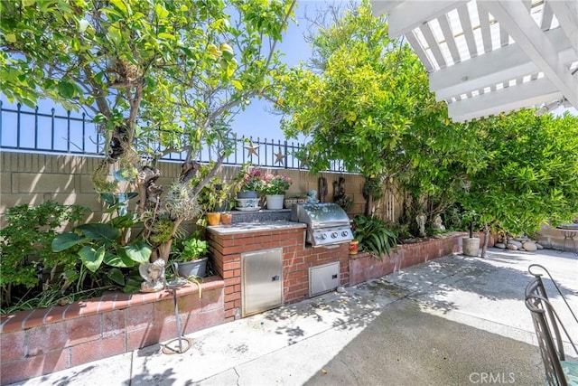 9909 Merced River Ave, Fountain Valley, CA 92708 - view of patio with an outdoor kitchen