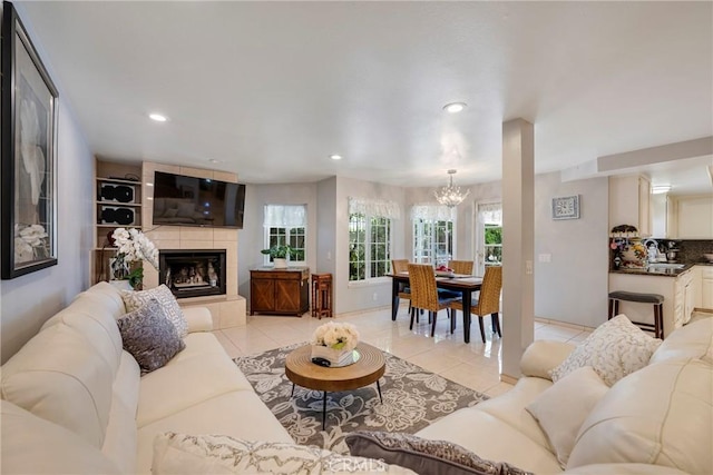 9909 Merced River Ave, Fountain Valley, CA 92708 - living room featuring a chandelier, light tile patterned floors, recessed lighting, and a fireplace