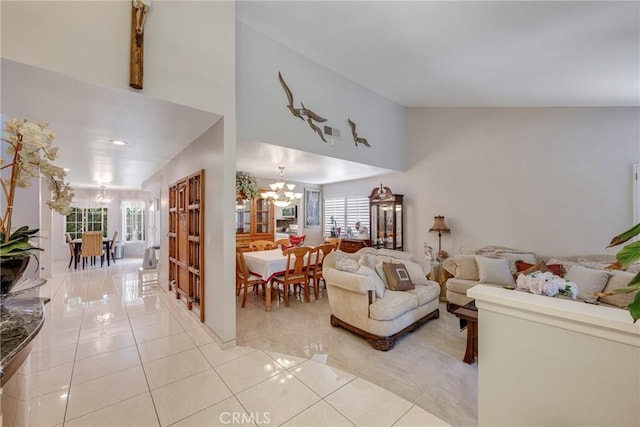 9909 Merced River Ave, Fountain Valley, CA 92708 - living room featuring a chandelier, plenty of natural light, light tile patterned floors, and high vaulted ceiling