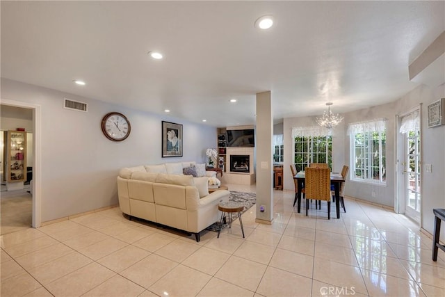 9909 Merced River Ave, Fountain Valley, CA 92708 - living room featuring a chandelier, recessed lighting, light tile patterned floors, and a tiled fireplace