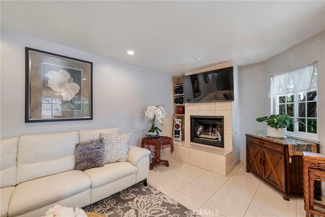 9909 Merced River Ave, Fountain Valley, CA 92708 - living area with a tiled fireplace, light tile patterned floors, and recessed lighting