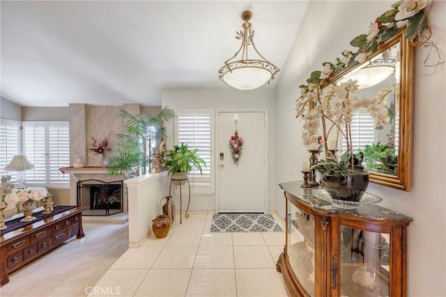 9909 Merced River Ave, Fountain Valley, CA 92708 - foyer entrance with a high end fireplace and light tile patterned flooring