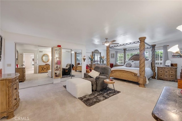 9909 Merced River Ave, Fountain Valley, CA 92708 - bedroom with light colored carpet, two closets, and a ceiling fan