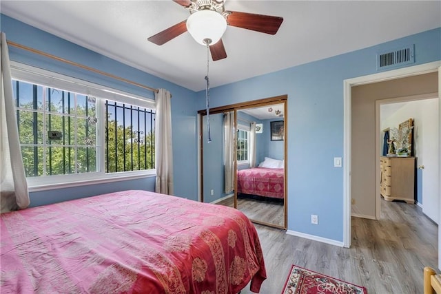 9909 Merced River Ave, Fountain Valley, CA 92708 - bedroom featuring wood finished floors, a closet, and ceiling fan