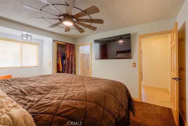 246 E Shasta St, Orland, CA 95963 - carpeted bedroom with a textured ceiling, tile patterned flooring, a ceiling fan, and a spacious closet