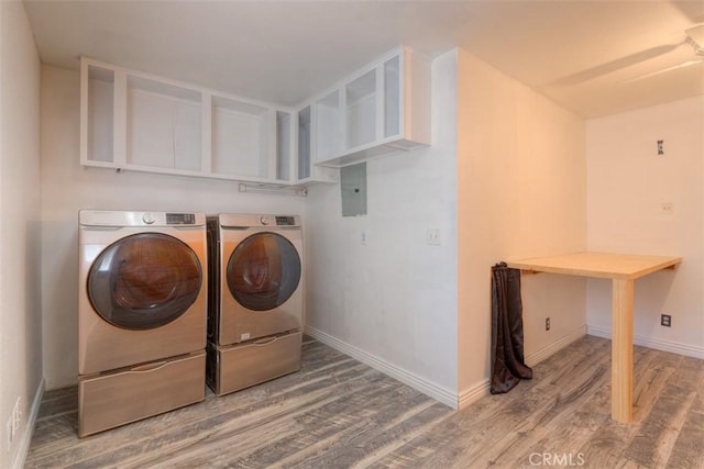 246 E Shasta St, Orland, CA 95963 - laundry room featuring washer and dryer, wood finished floors, and electric panel