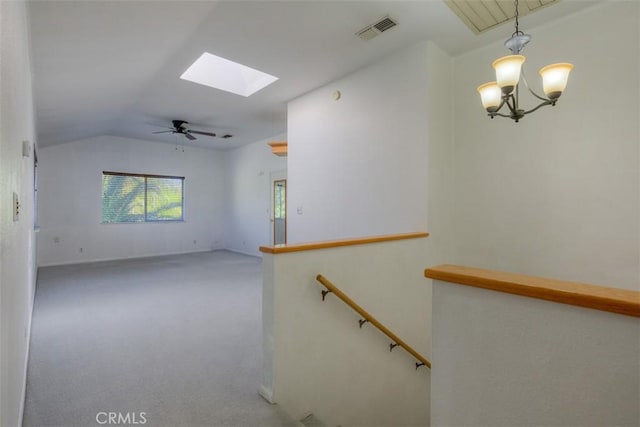 246 E Shasta St, Orland, CA 95963 - stairs featuring a skylight, vaulted ceiling, carpet flooring, a chandelier, and a ceiling fan
