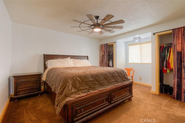246 E Shasta St, Orland, CA 95963 - bedroom with carpet flooring, ceiling fan, a textured ceiling, and a spacious closet