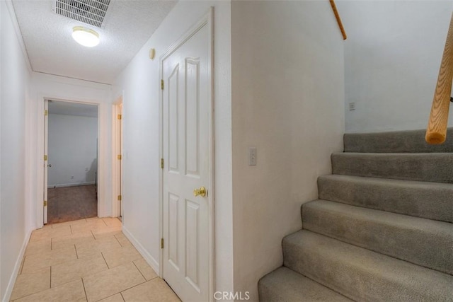246 E Shasta St, Orland, CA 95963 - staircase with tile patterned flooring and a textured ceiling