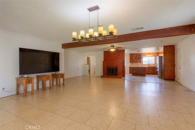 246 E Shasta St, Orland, CA 95963 - unfurnished living room with ceiling fan, a chandelier, and a fireplace