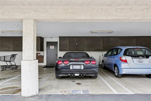 18900 Delaware St Unit 214, Huntington Beach, CA 92648 - view of vehicle parking with a parking deck