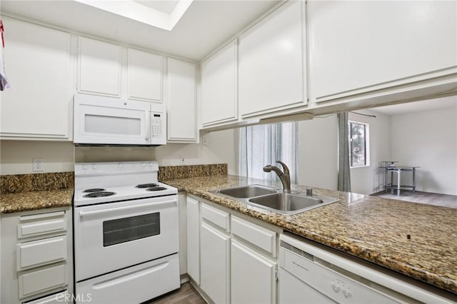 18900 Delaware St Unit 214, Huntington Beach, CA 92648 - kitchen with white appliances, white cabinets, and wood finished floors