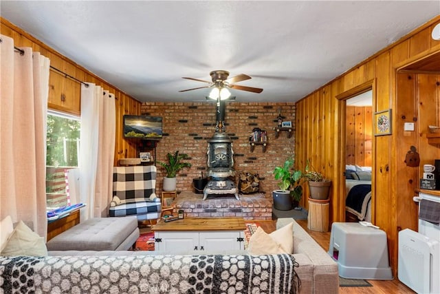 32135 W Dr, Running Springs, CA 92382 - living area with ceiling fan, light wood finished floors, and wood walls