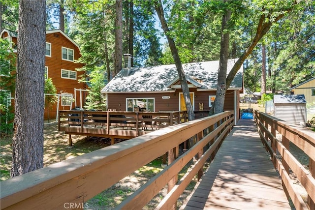 32135 W Dr, Running Springs, CA 92382 - back of house with a deck and a chimney
