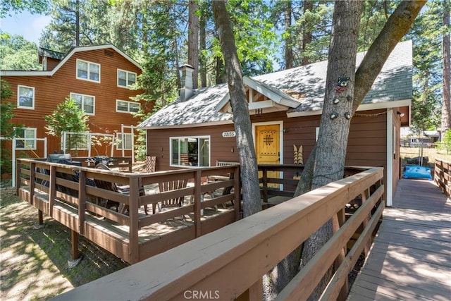 32135 W Dr, Running Springs, CA 92382 - back of house featuring a deck and a chimney