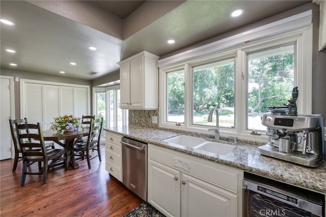 2640 Tenaya Way, Fresno, CA 93711 - kitchen with stainless steel dishwasher, dishwasher, recessed lighting, white cabinetry, and dark wood-type flooring