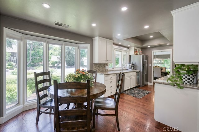 2640 Tenaya Way, Fresno, CA 93711 - dining room with dark wood-style floors, recessed lighting, and a raised ceiling
