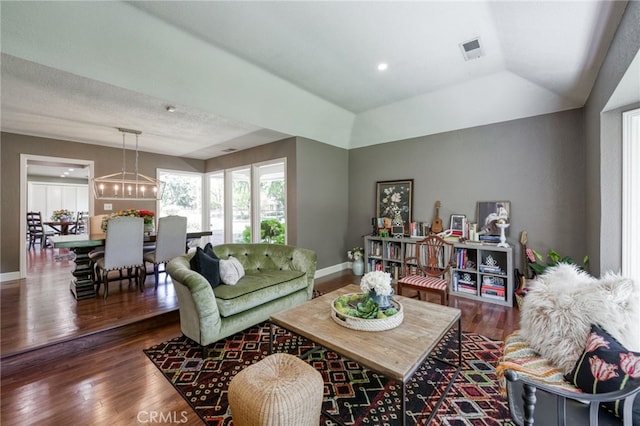 2640 Tenaya Way, Fresno, CA 93711 - living room with wood finished floors, vaulted ceiling, and a chandelier