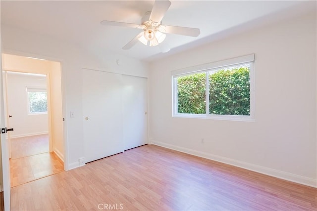 7215 Enfield Ave, Reseda, CA 91335 - unfurnished bedroom with light wood finished floors, a closet, and ceiling fan