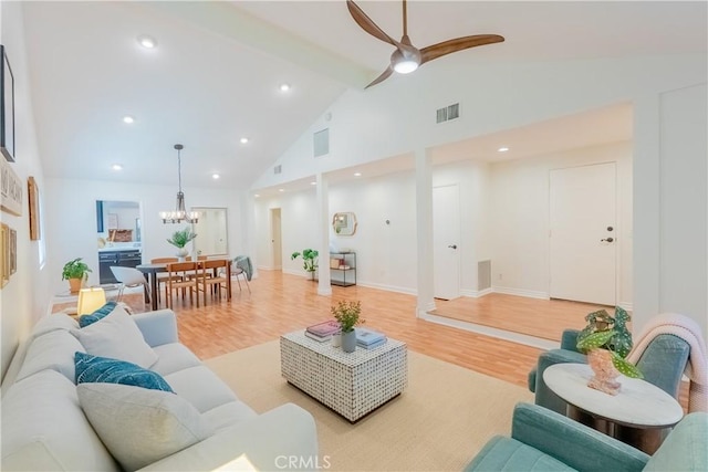 7215 Enfield Ave, Reseda, CA 91335 - living area with high vaulted ceiling, a chandelier, light wood-style floors, beamed ceiling, and ceiling fan