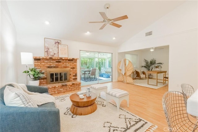 7215 Enfield Ave, Reseda, CA 91335 - living area with a ceiling fan, wood finished floors, high vaulted ceiling, a fireplace, and recessed lighting