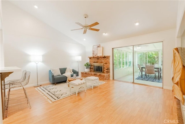7215 Enfield Ave, Reseda, CA 91335 - living area with a fireplace, wood finished floors, a ceiling fan, and vaulted ceiling