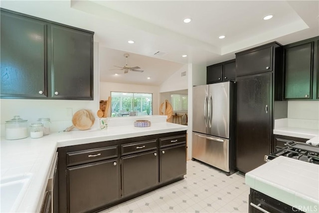 7215 Enfield Ave, Reseda, CA 91335 - kitchen featuring freestanding refrigerator, light floors, a ceiling fan, a raised ceiling, and a peninsula