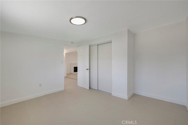 8888 Patrero St, Riverside, CA 92503 - unfurnished bedroom featuring a fireplace and a closet