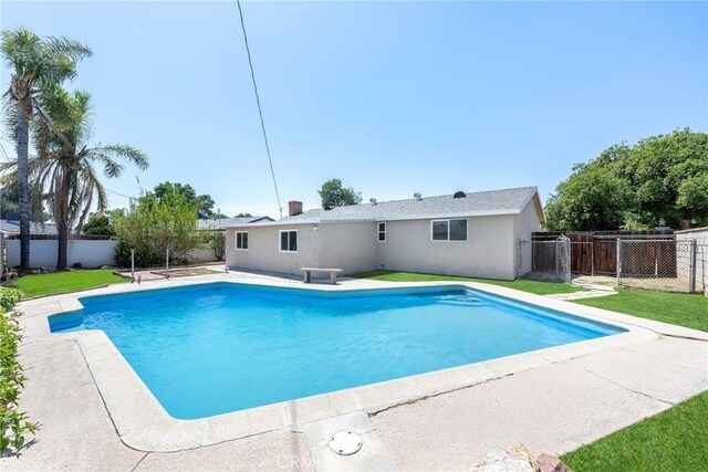 8888 Patrero St, Riverside, CA 92503 - view of swimming pool featuring a fenced backyard and a patio