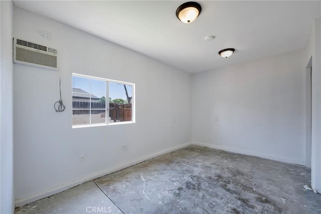 8888 Patrero St, Riverside, CA 92503 - unfurnished room featuring a wall mounted AC and a smoke detector