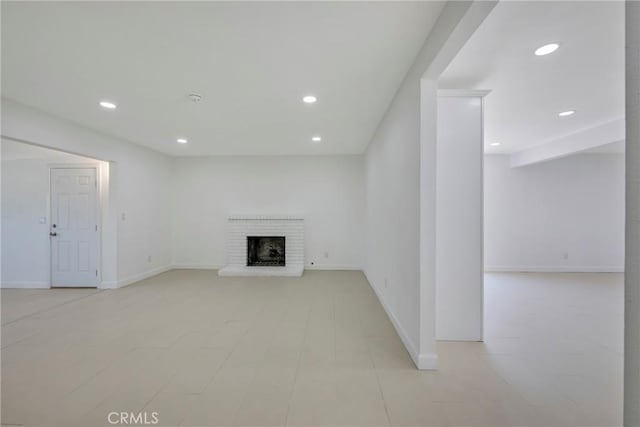 8888 Patrero St, Riverside, CA 92503 - unfurnished living room with recessed lighting and a brick fireplace